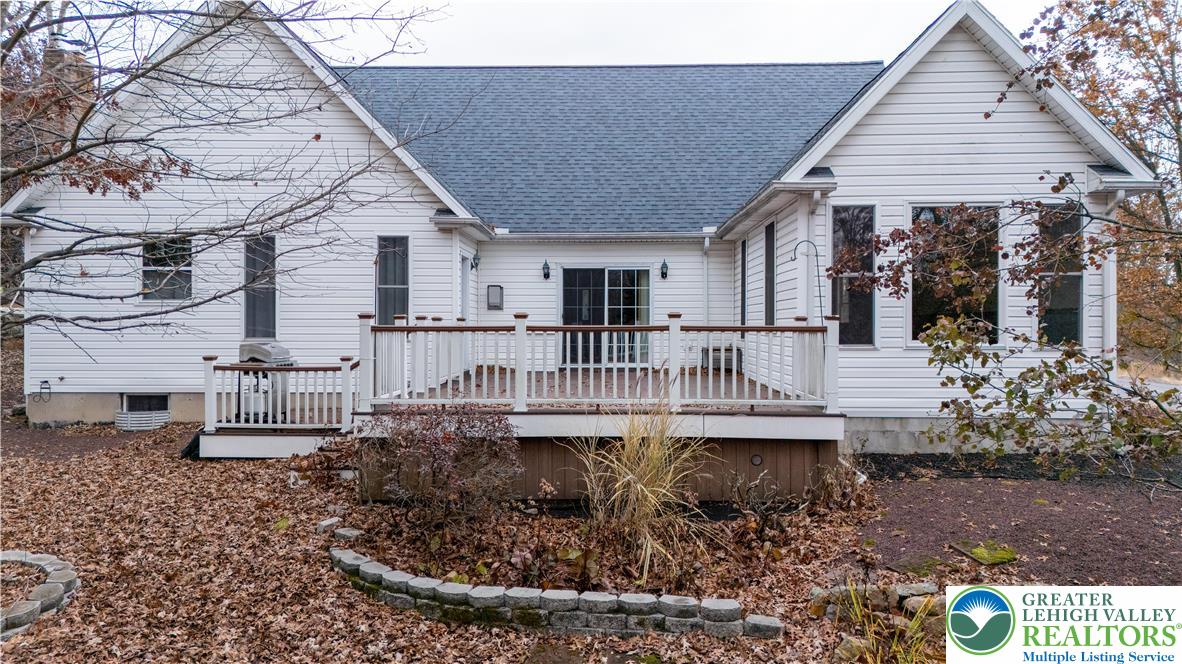 1 Pinewood Circle Hazleton, PA 18202 - Photo 4 of 33 a view of a house with a wooden deck and furniture