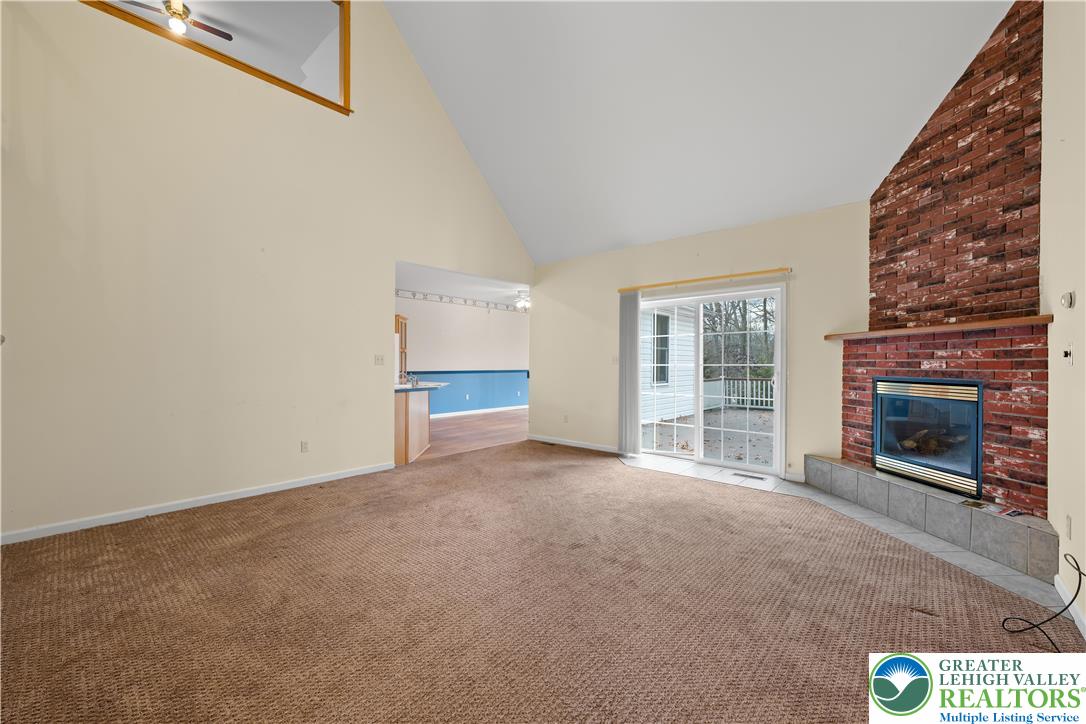 1 Pinewood Circle Hazleton, PA 18202 - Photo 8 of 33 a view of an empty room with a fireplace and a window