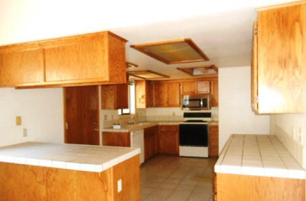 18870 Reeds Creek Road Red Bluff, CA 96080 - Photo 5 of 10 a kitchen with stainless steel appliances granite countertop a sink and a stove