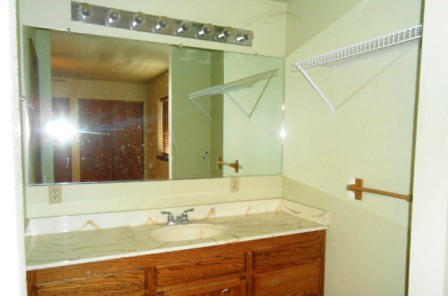 18870 Reeds Creek Road Red Bluff, CA 96080 - Photo 10 of 10 a bathroom with a granite countertop sink and a mirror