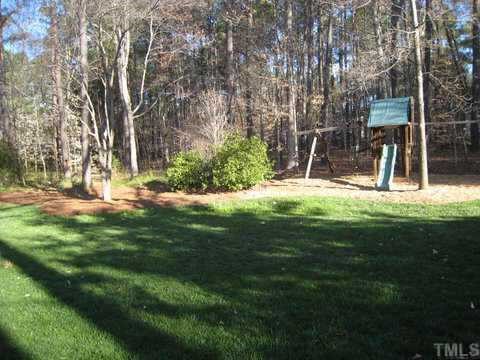 2841 Mattlyn Court Raleigh, NC 27613 - Photo 12 of 12 a view of a backyard with large trees