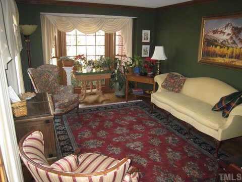 2841 Mattlyn Court Raleigh, NC 27613 - Photo 2 of 12 a living room with furniture and a large window