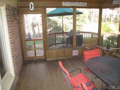 2841 Mattlyn Court Raleigh, NC 27613 - Photo 10 of 12 a balcony with couch and outdoor view