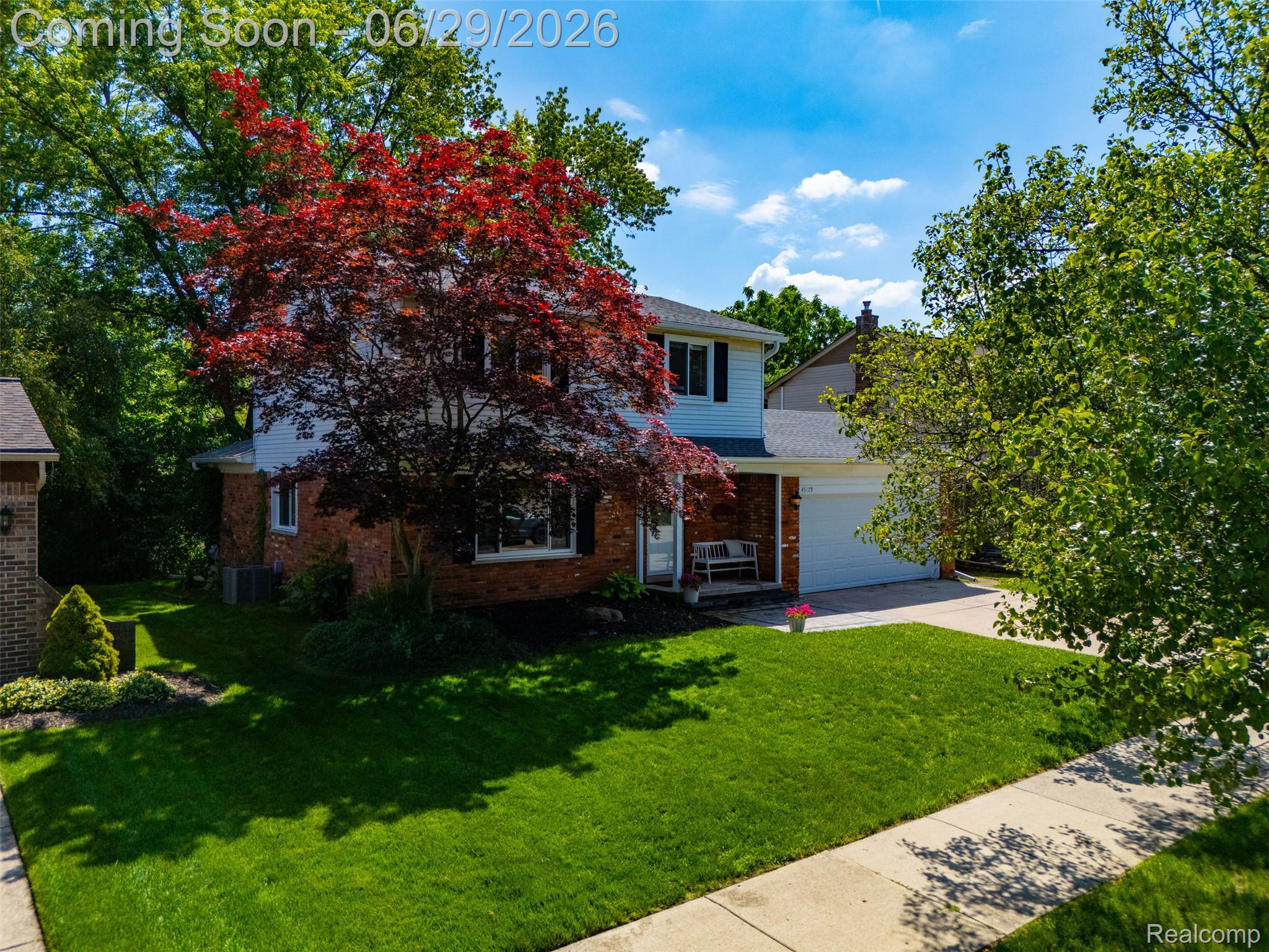 45179 Rudgate Road Canton, MI 48188 - Photo 32 of 48 Two-story residence featuring a brick and siding exterior with a prominent red-leafed tree