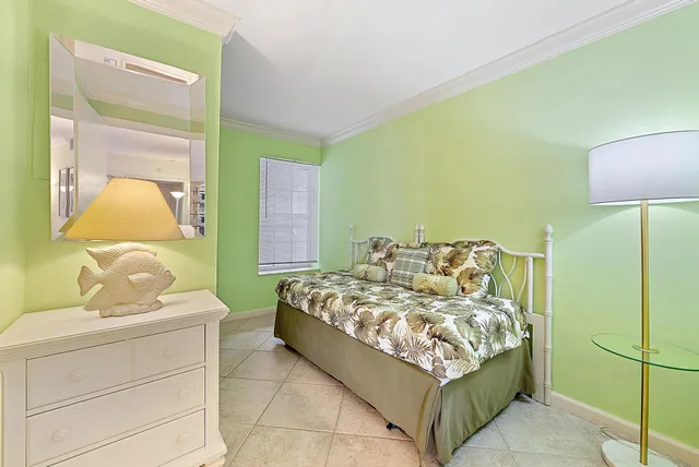 a bed room with a bed and a lamp