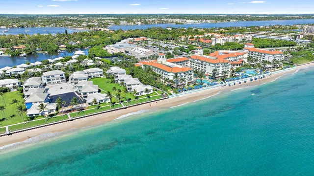 an aerial view of residential houses with city view