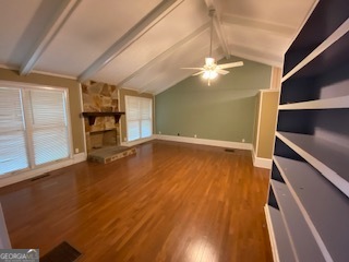 1117 Boss Hardy Road Auburn, GA 30011 - Photo 10 of 19 wooden floor in an empty room with a window