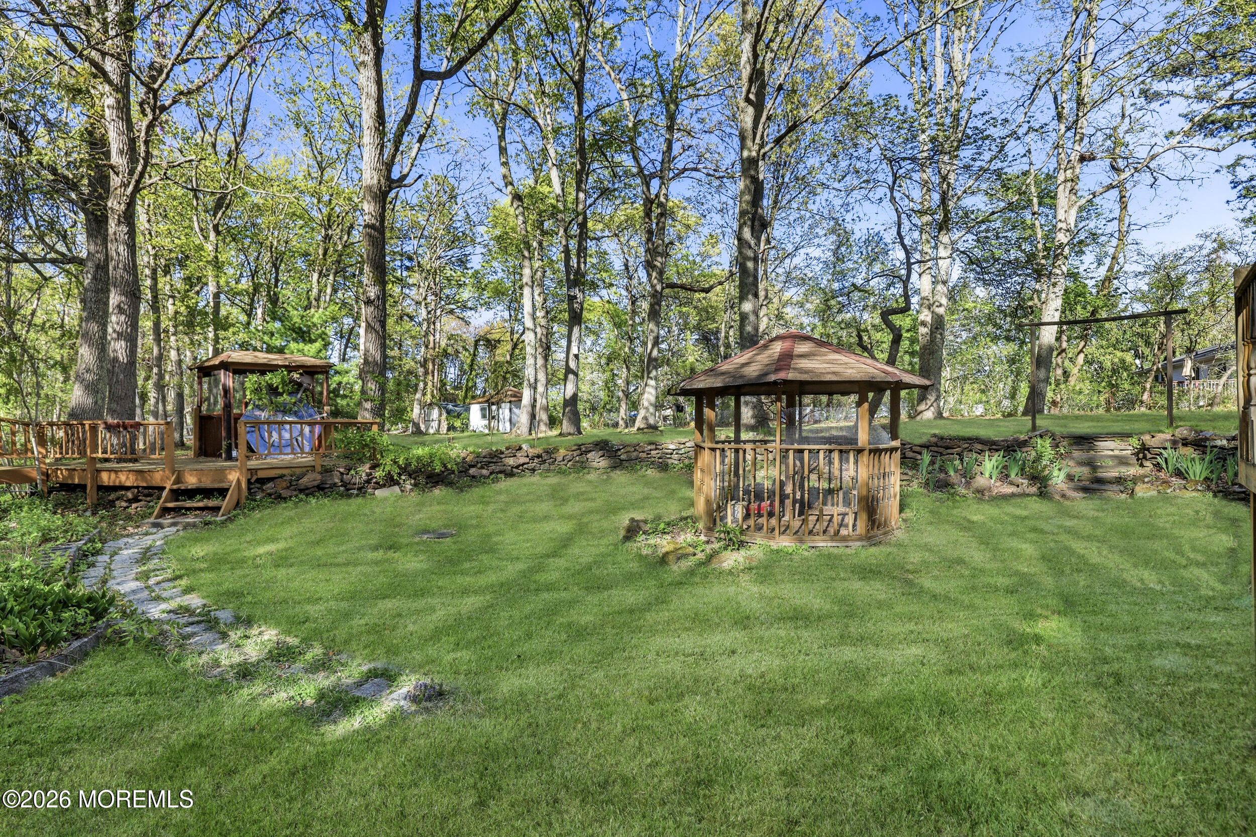492 Cobain Road Jackson, NJ 08527 - Photo 43 of 47 a view of a chair and table on the garden