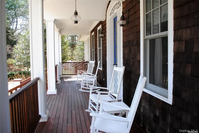 a view of a living room with furniture and a window