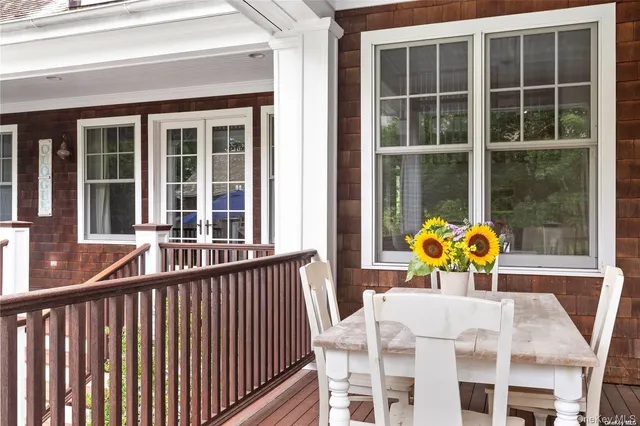 a view of a balcony with chairs