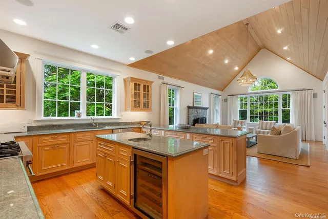 a kitchen with granite countertop a stove and a sink