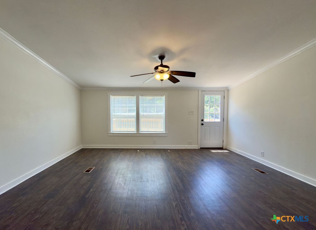 375 Alto Lane Waco, TX 76705 - Photo 17 of 27 a view of an empty room with wooden floor and a window