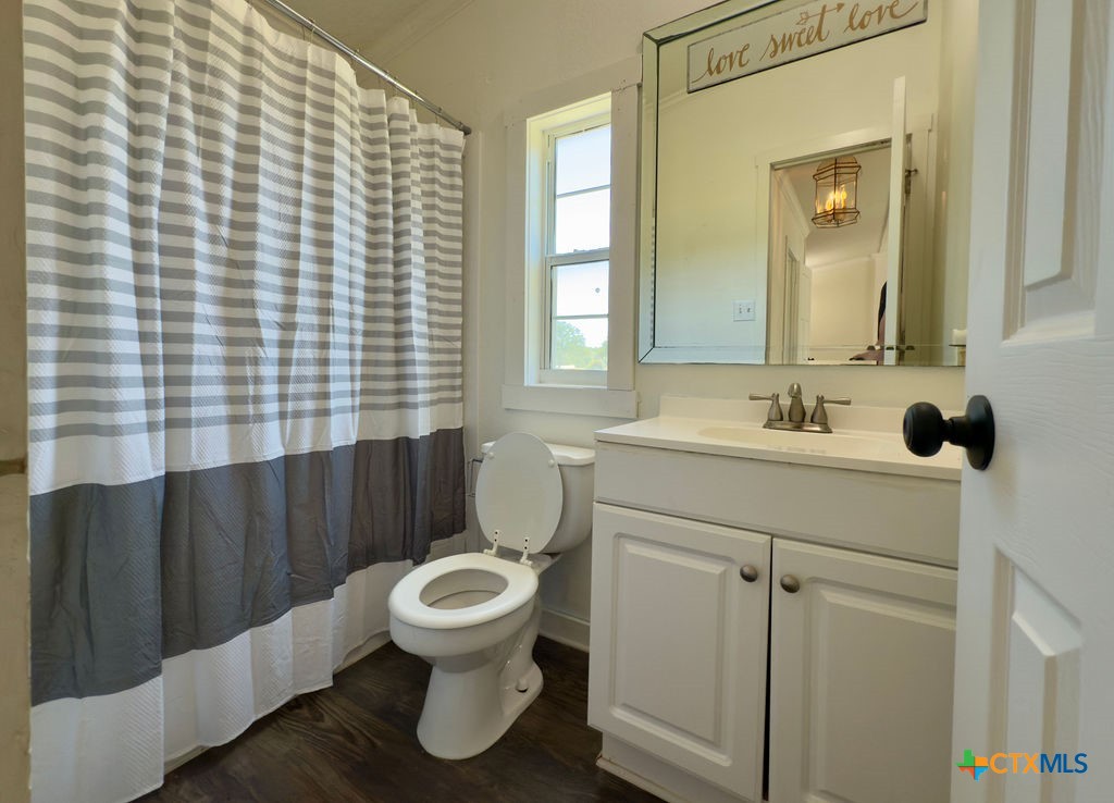 375 Alto Lane Waco, TX 76705 - Photo 26 of 27 a bathroom with a sink toilet and mirror