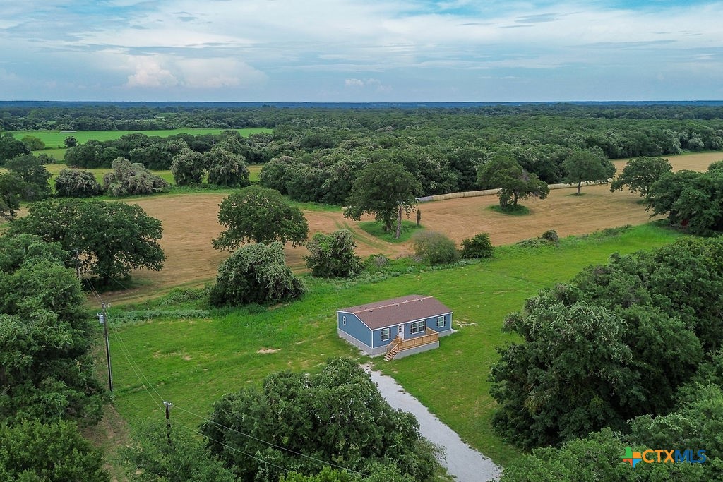 375 Alto Lane Waco, TX 76705 - Photo 10 of 27 a view of a lake with huge green field with large trees