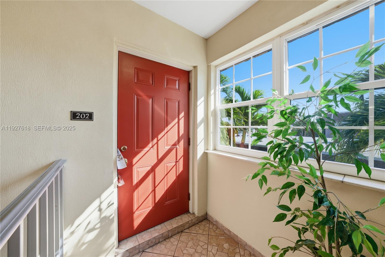 221 Southeast 9th Avenue, Unit 202 Pompano Beach, FL 33060 - Photo 12 of 19 a view of entryway with flower plants