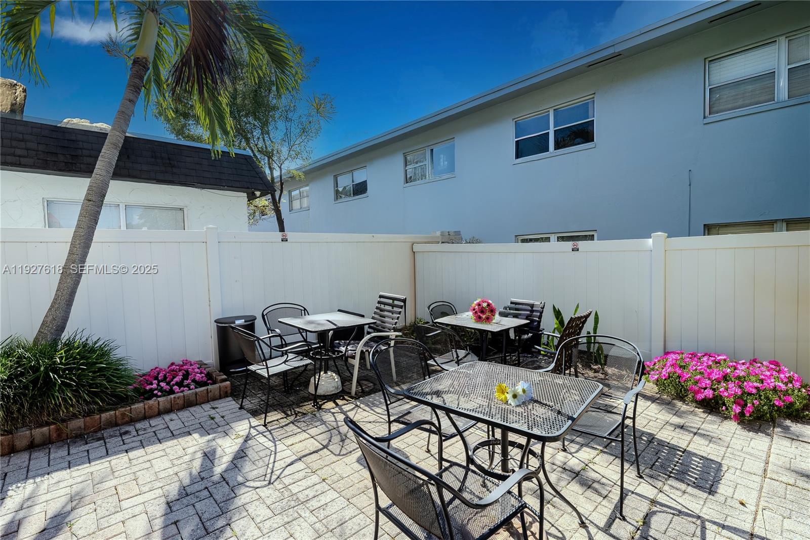 221 Southeast 9th Avenue, Unit 202 Pompano Beach, FL 33060 - Photo 18 of 19 a backyard of a house with seating space