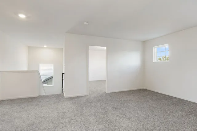 a view of an empty room with a closet