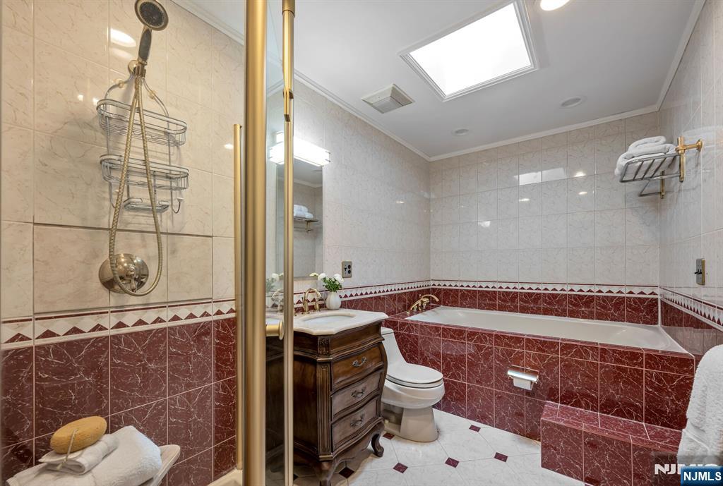84 Bogerts Mill Road Harrington Park, NJ 07640 - Photo 33 of 47 a bathroom with a sink a toilet and shower