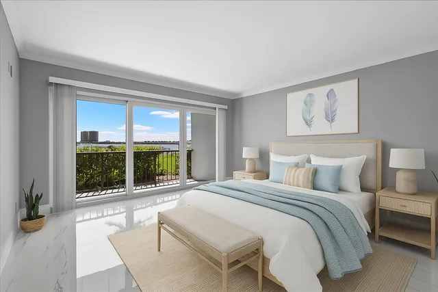 a bedroom with a large bed and a large window