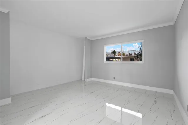 a bathroom with a toilet a sink a vanity and mirror