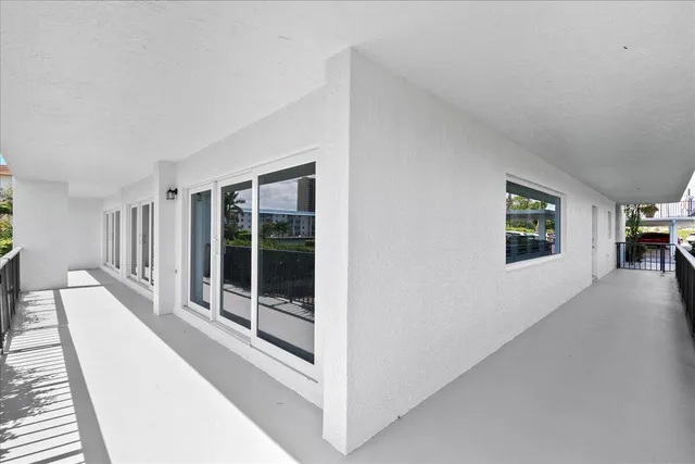 a view of a balcony with an ocean view