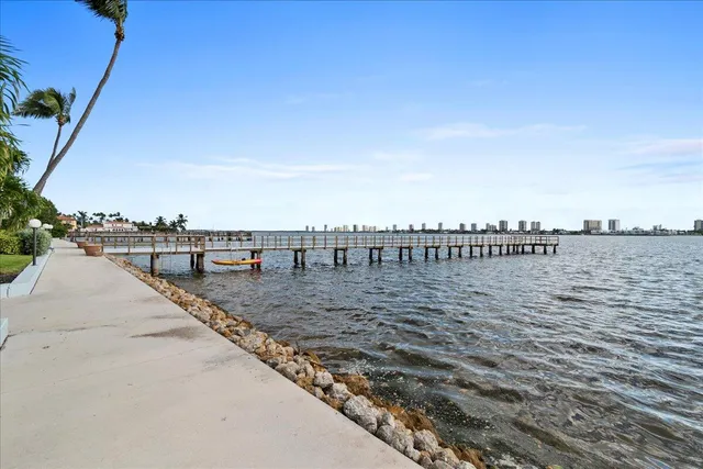 a swimming pool with outdoor seating and yard
