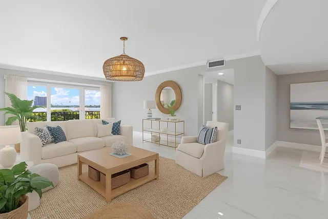 a living room with furniture a rug and a clock