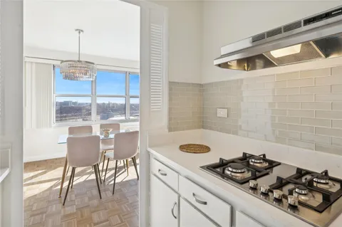 a bedroom with bed and windows
