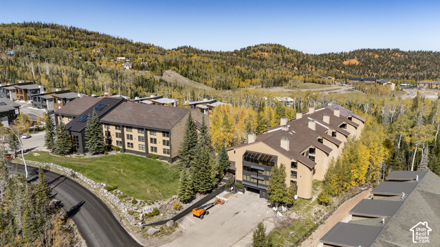 150 Ridgeview Street Brian Head, UT 84719 - Photo 39 of 43 Multi-level properties with sloped roofs, surrounded by mature evergreen trees and deciduous trees