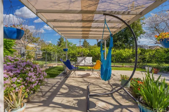 a view of yard with patio