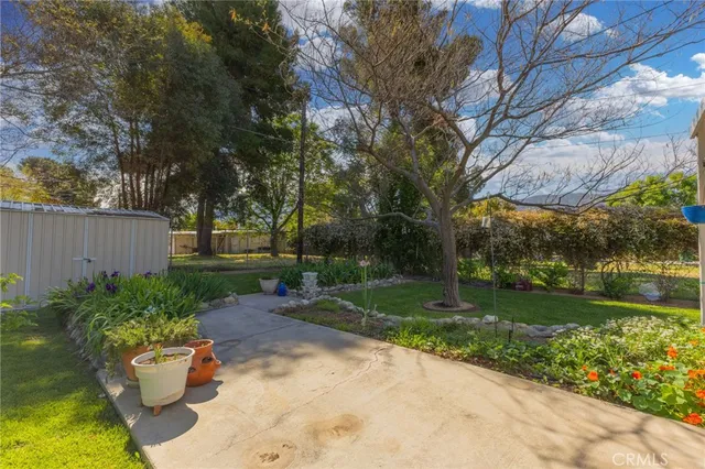 a backyard of a house with outdoor seating