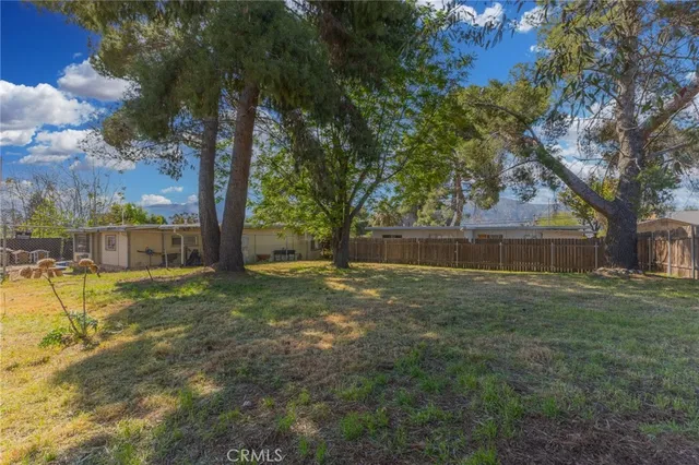 a view of backyard with green space