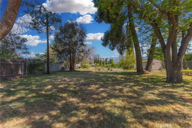 a view of a building in the middle of a park