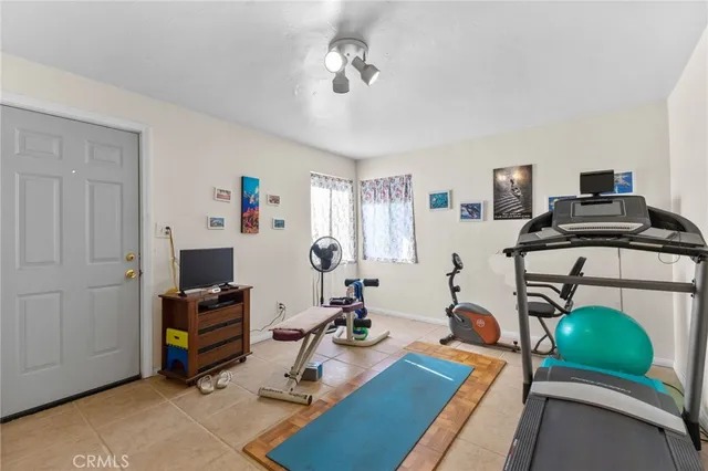 a view of a workspace with furniture and a bedroom