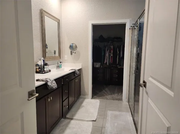a kitchen with a sink and a refrigerator