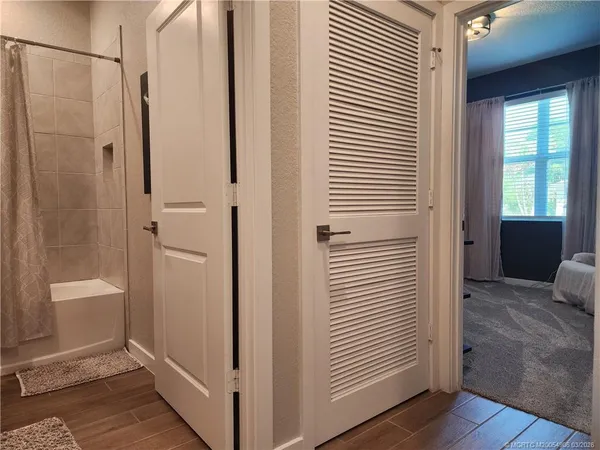 a view of a bathroom from a hallway