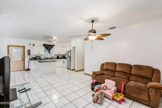 a bed room with a bed and a chair