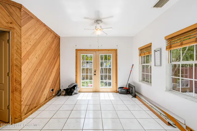a bedroom with furniture and flat screen tv