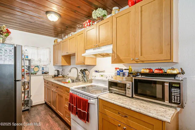 a house view with a sitting space and garden