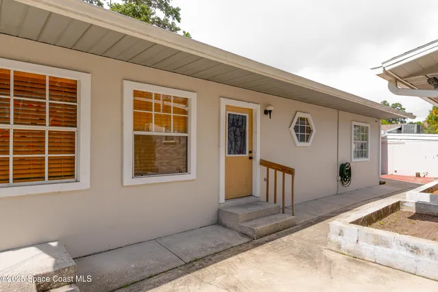 a kitchen with stainless steel appliances a stove refrigerator and cabinets