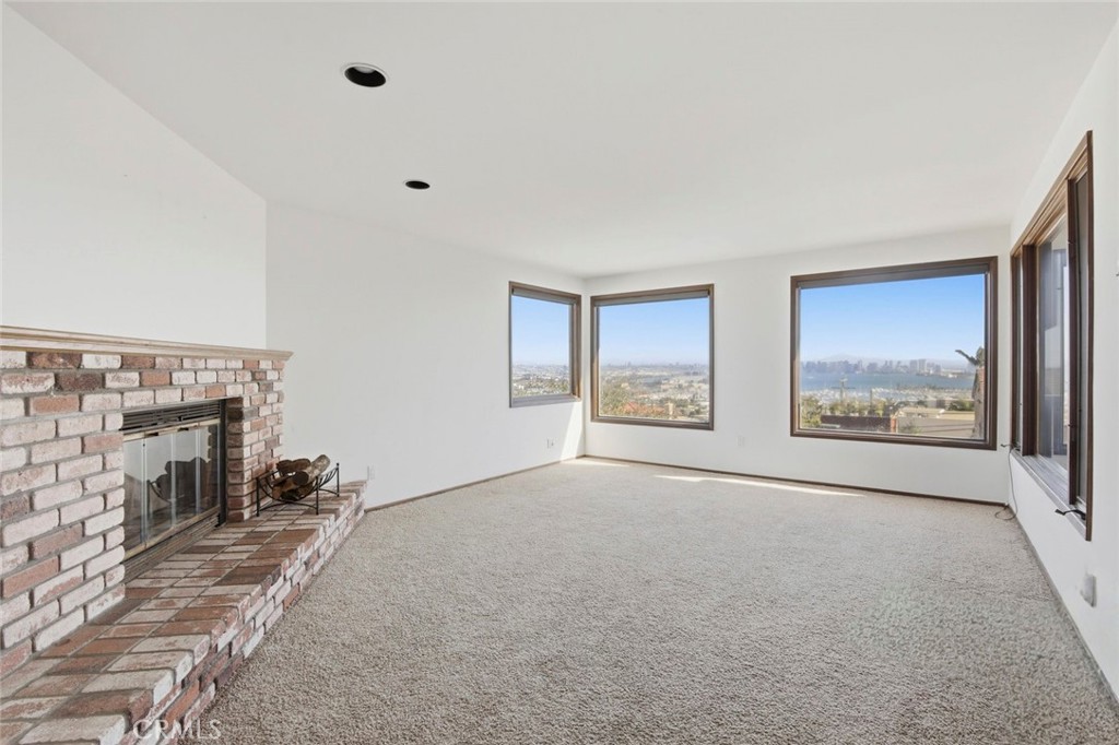 3320 Hill San Diego Ca San Diego, CA 92106 - Photo 12 of 39 a view of an empty room with a fireplace and a window