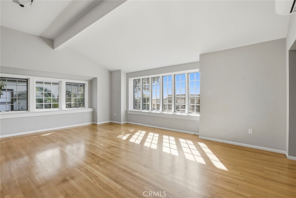 3320 Hill San Diego Ca San Diego, CA 92106 - Photo 21 of 39 a view of an empty room with wooden floor and a window