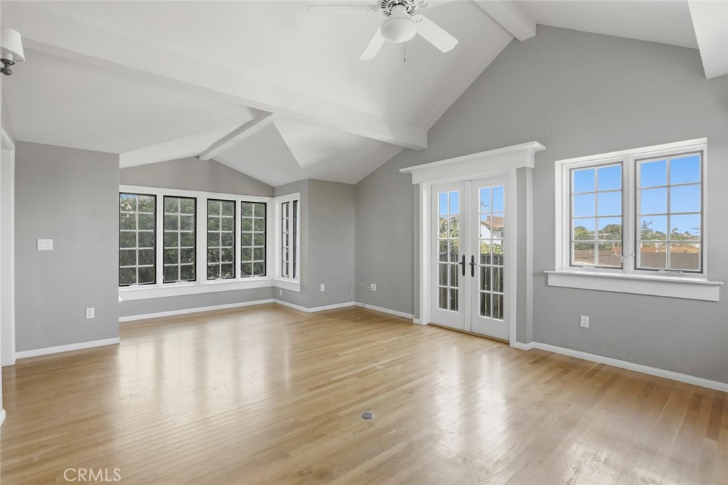 3320 Hill San Diego Ca San Diego, CA 92106 - Photo 23 of 39 a view of an empty room with a window and wooden floor