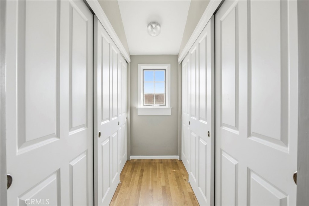 3320 Hill San Diego Ca San Diego, CA 92106 - Photo 28 of 39 a view of a hallway with wooden floor and a bathroom
