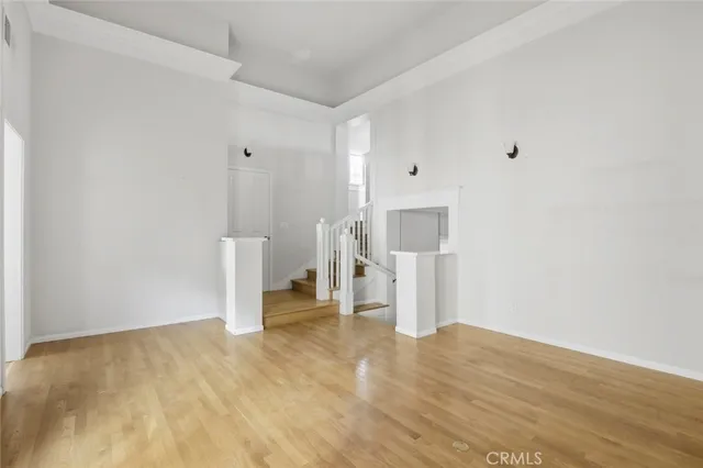 a view of a room with a sink and refrigerator