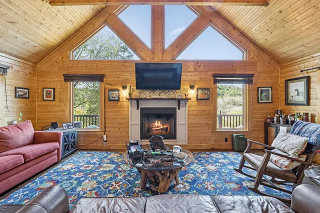 a bedroom with a large bed and a large window