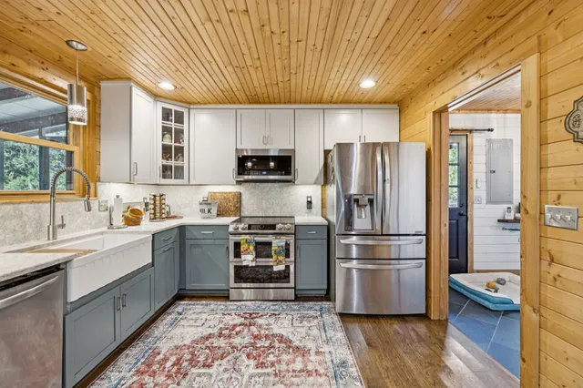 a bathroom with a shower and a sink