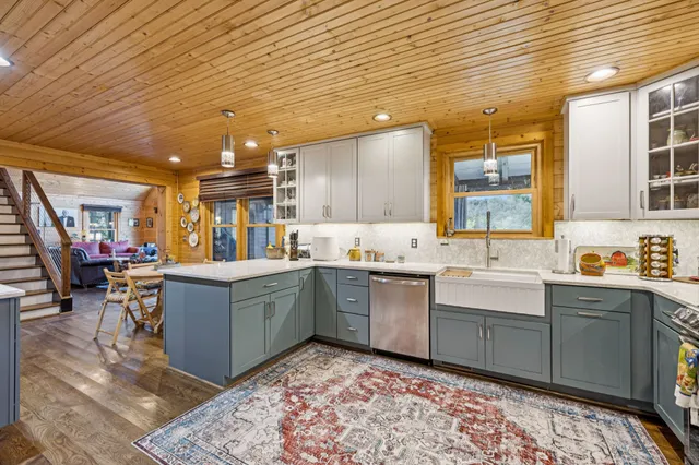 a bedroom with a bed and a view of kitchen