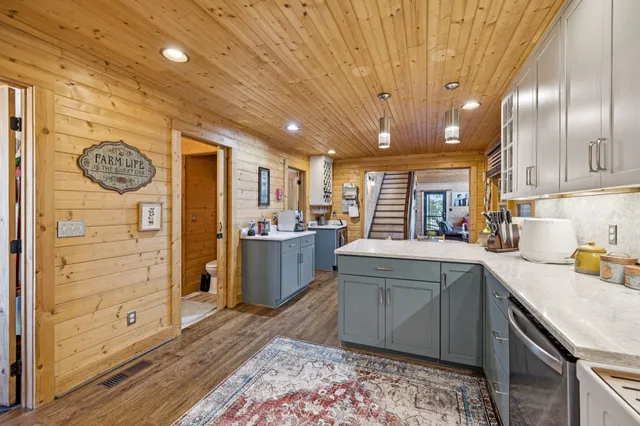 a hallway with a large window and couch