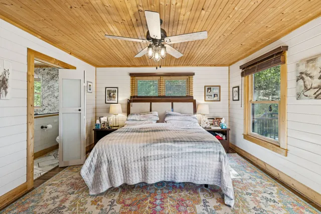 a living room with furniture a rug and a window